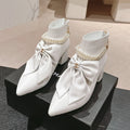 SHORT BOOTS IN WHITE SHEEPSKIN WITH BOW