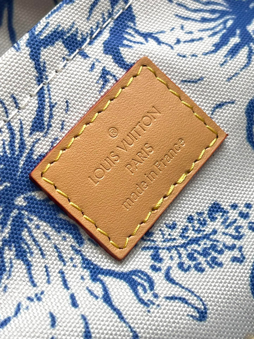 ONTHEGO EAST WEST 25 IN LAGOON BLUE MONOGRAM TILES CANVAS