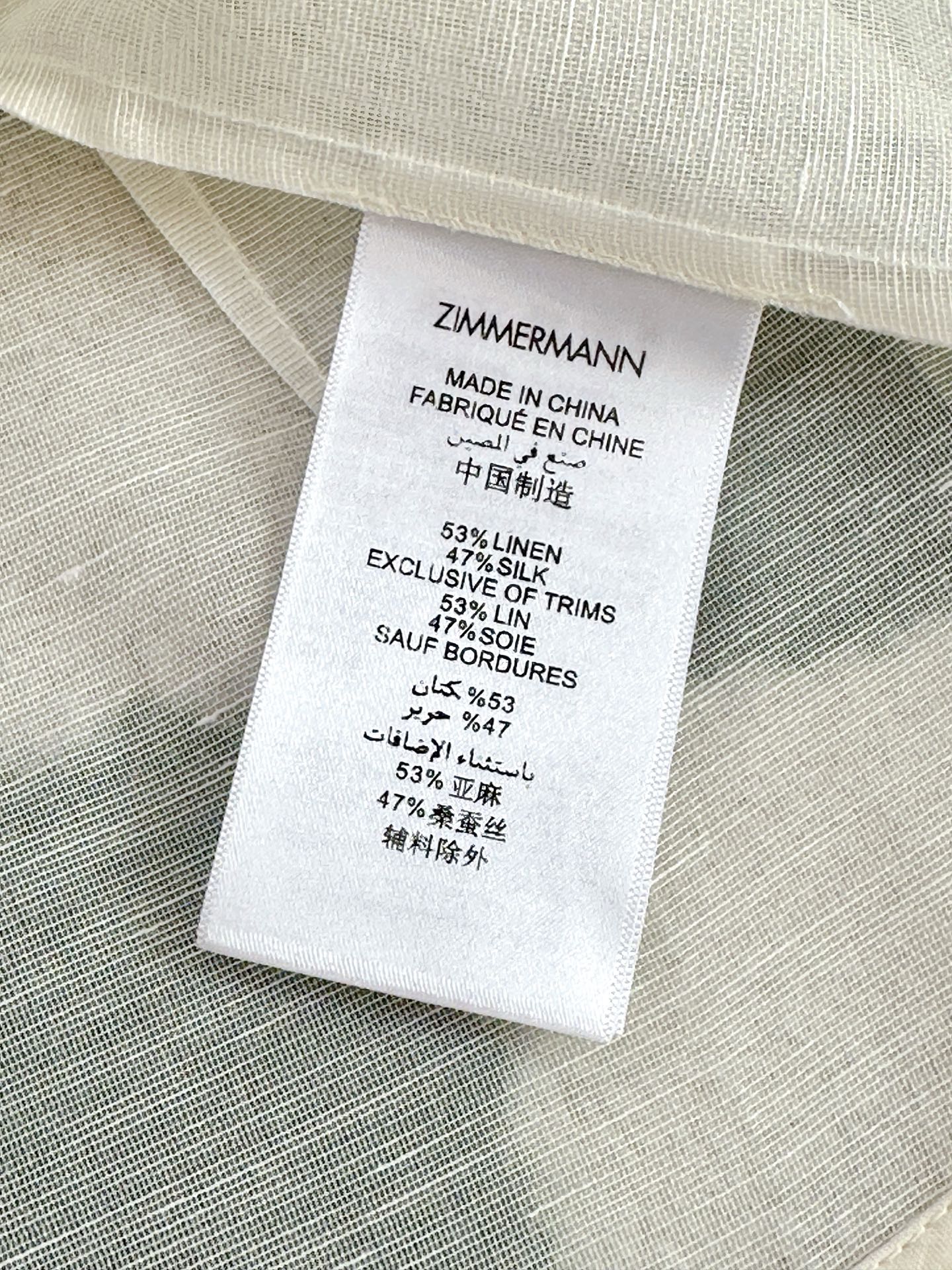 WHITE DRESSY TOP WITH BLACK TIE-NECK