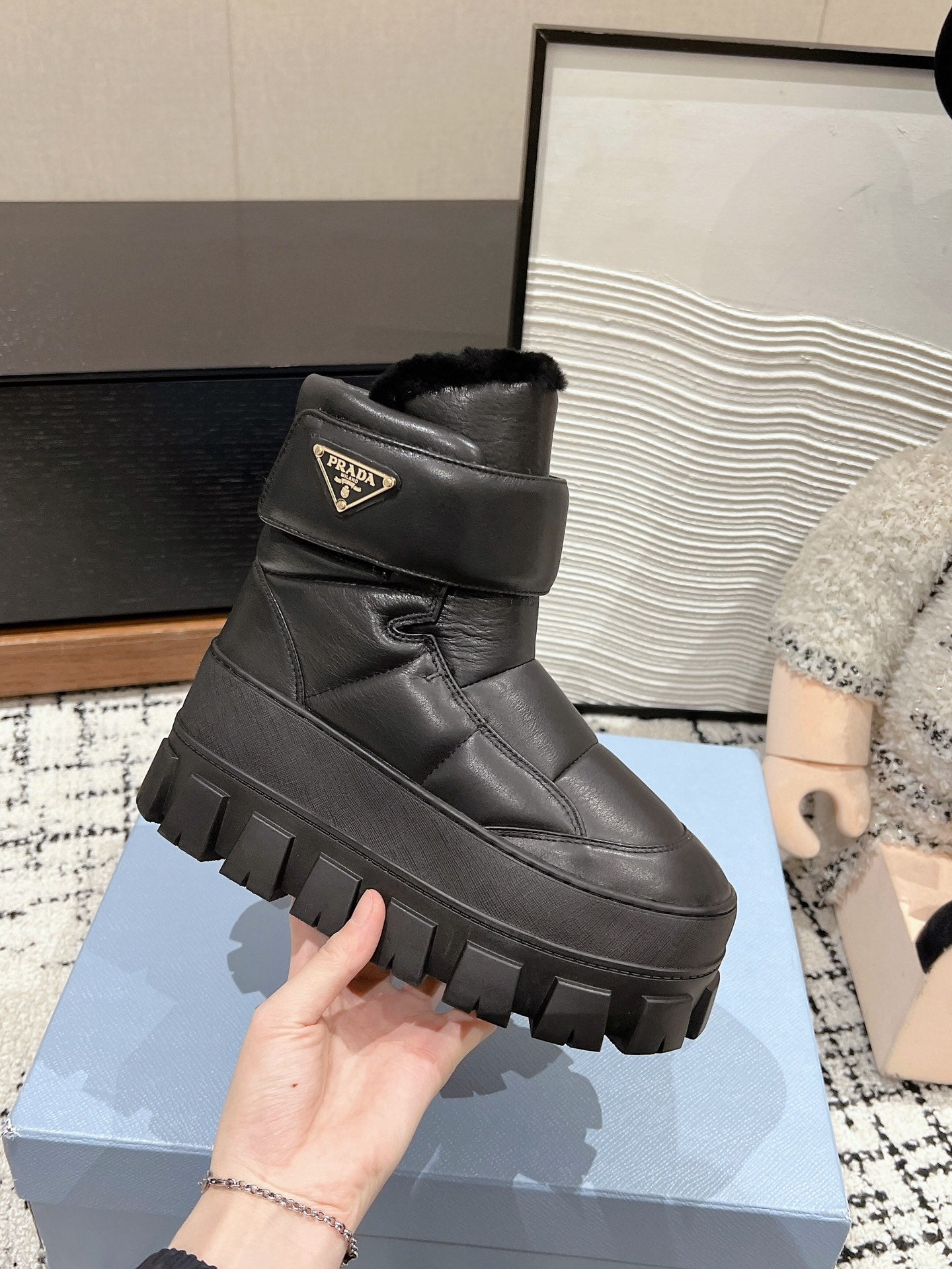 MONOLITH ANKLE BOOTS WITH STRAP IN BLACK CALFSKIN AND FLEECE LINING