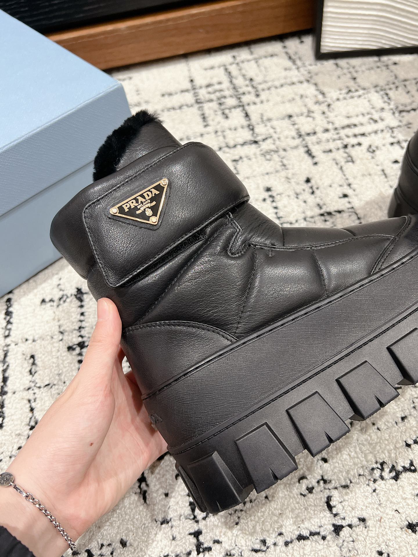 MONOLITH ANKLE BOOTS WITH STRAP IN BLACK CALFSKIN AND FLEECE LINING