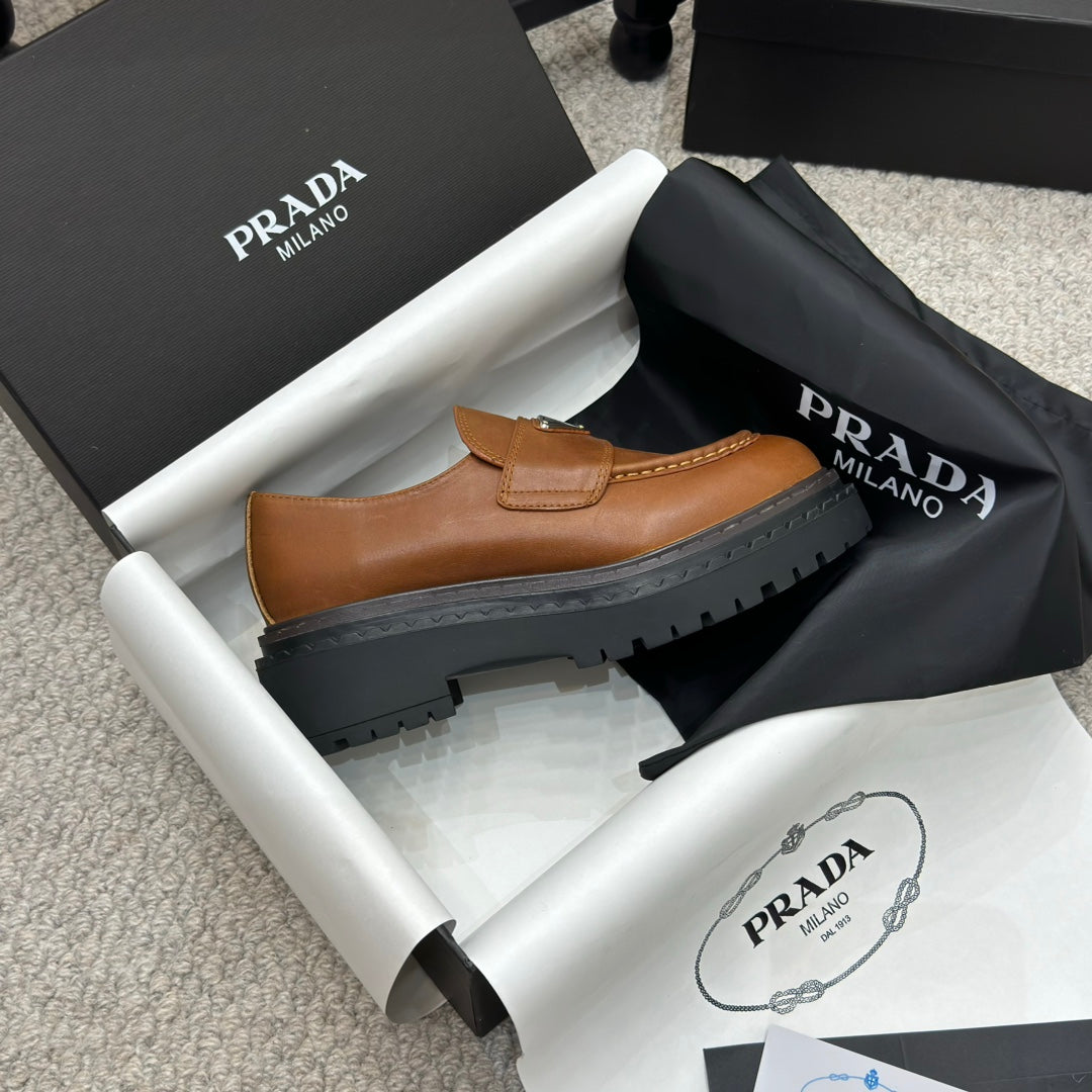 PRADA 25S LOAFER 50MM IN BURNT ORANGE CALFSKIN LOGO