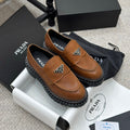 PRADA 25S LOAFER 50MM IN BURNT ORANGE CALFSKIN LOGO