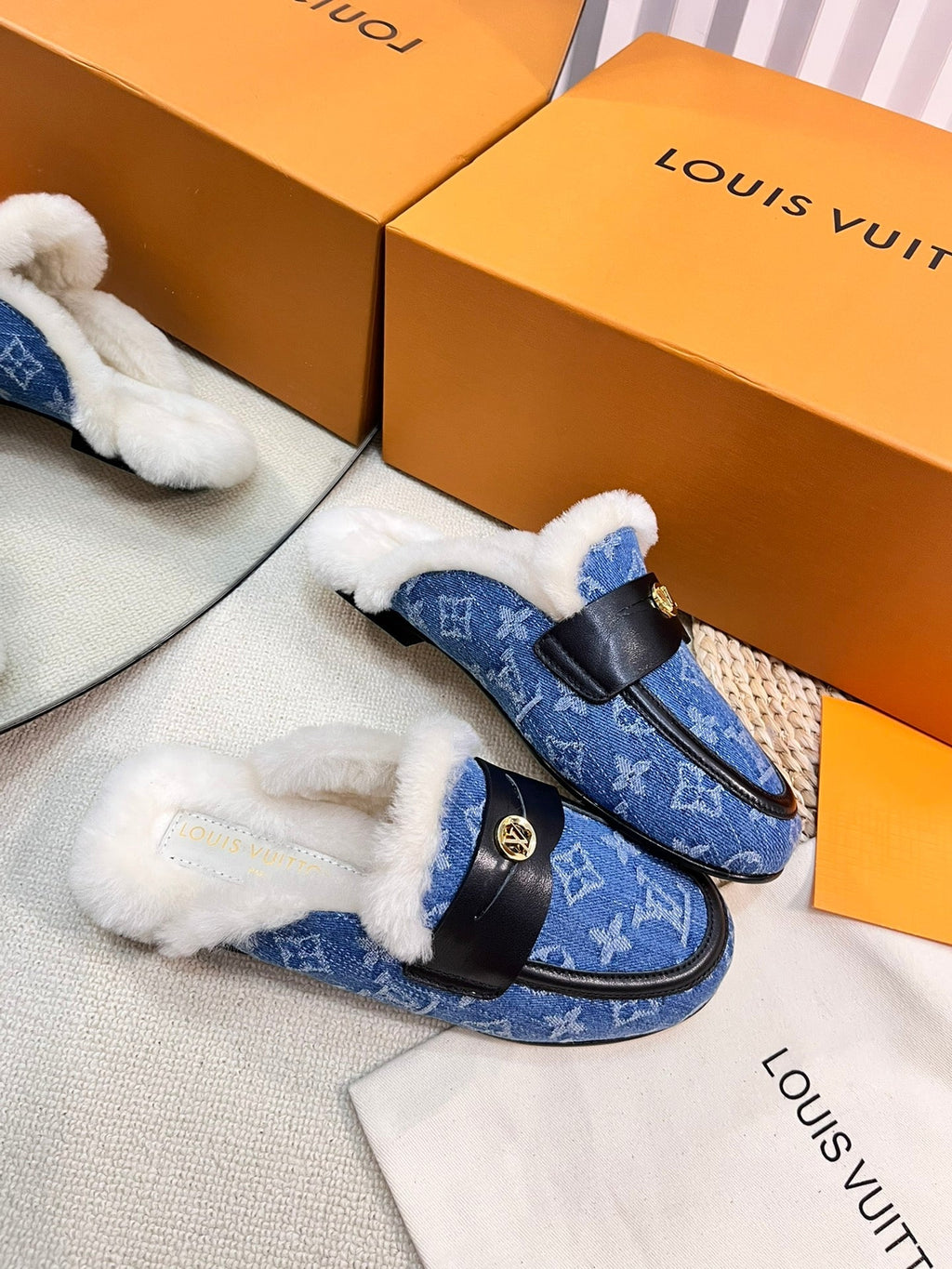 FLAT MULE IN COBALT BLUE MONOGRAM DENIM AND SHEARLING LINING
