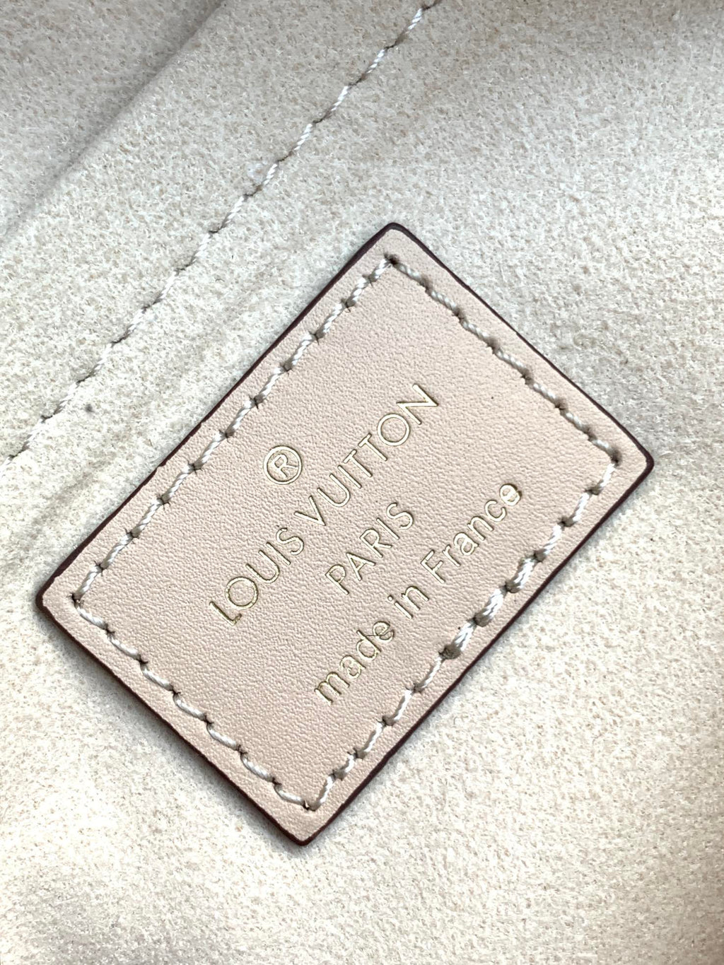 LV 25S ONTHEGO EAST WEST BAG 25 IN CREAM CALFSKIN MONOGRAM EMPREINTE