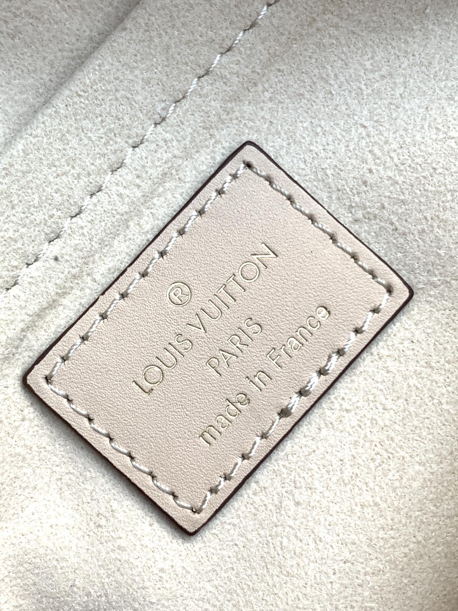 LV 25S ONTHEGO EAST WEST BAG 25 IN CREAM CALFSKIN MONOGRAM EMPREINTE