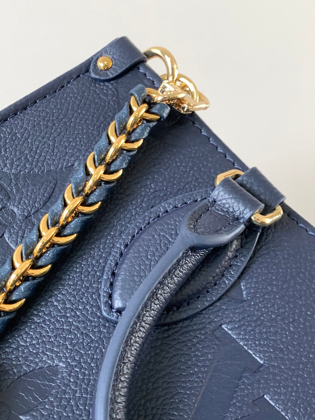 LV 25S ONTHEGO EAST WEST BAG 25 IN NAVY BLUE CALFSKIN MONOGRAM EMPREINTE