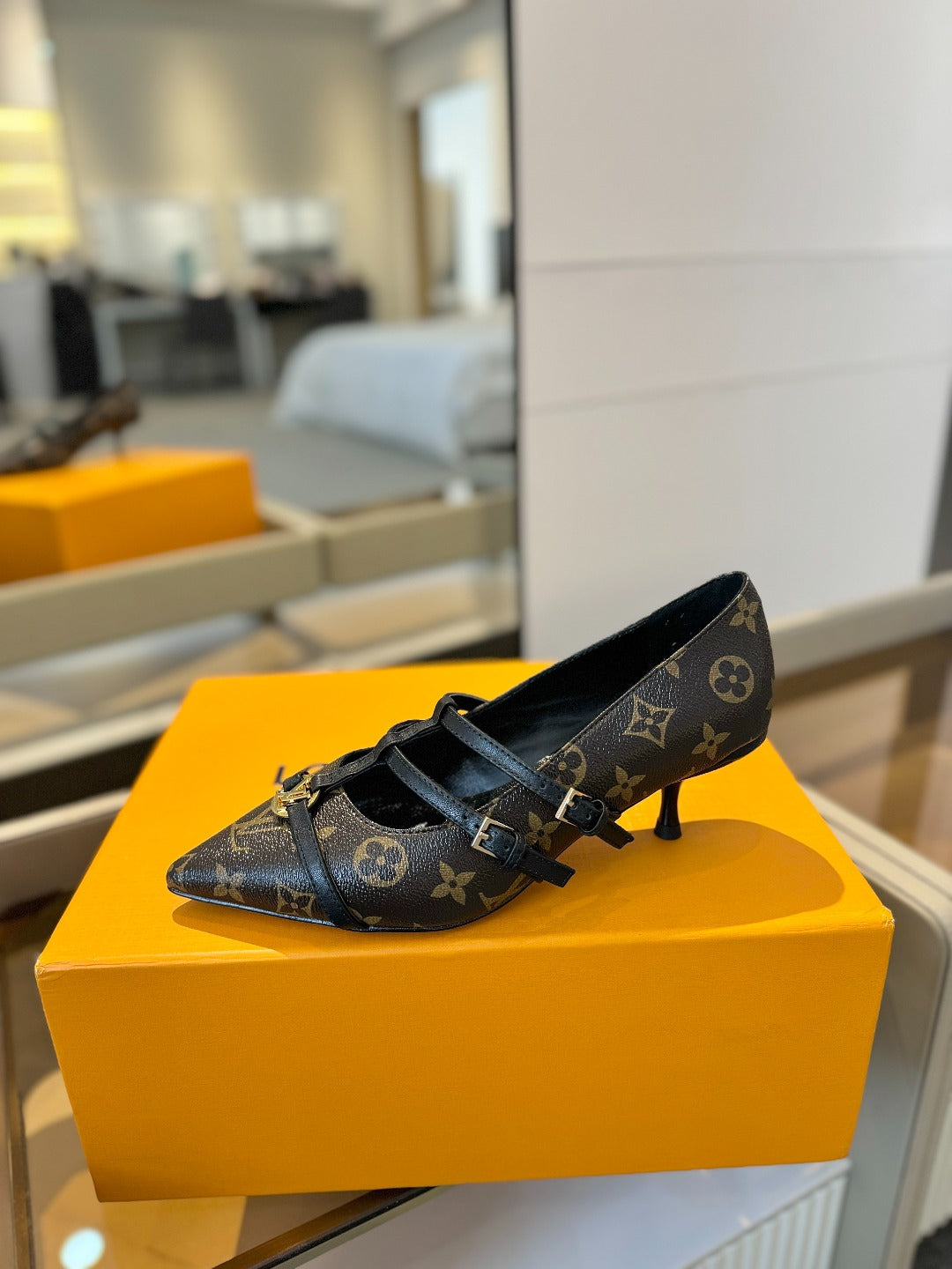 HIGH PUMP 5 CM TRIPLE-STRAP IN CHOCOLATE BROWN MONOGRAM CALFSKIN WITH BLACK STRAP