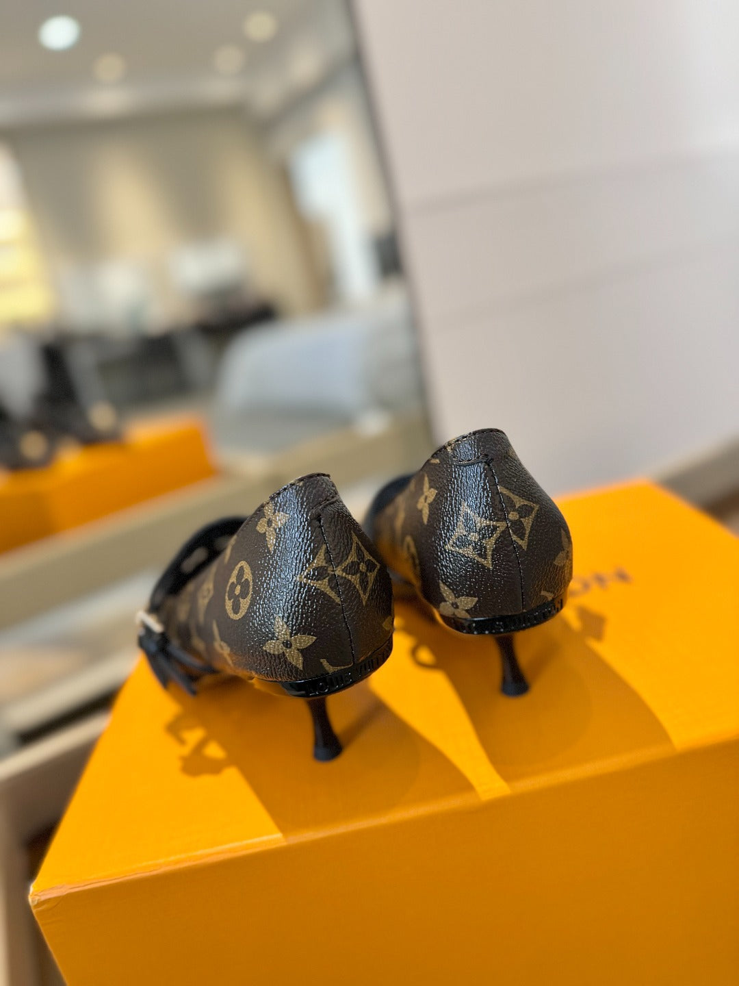 HIGH PUMP 5 CM TRIPLE-STRAP IN CHOCOLATE BROWN MONOGRAM CALFSKIN WITH BLACK STRAP