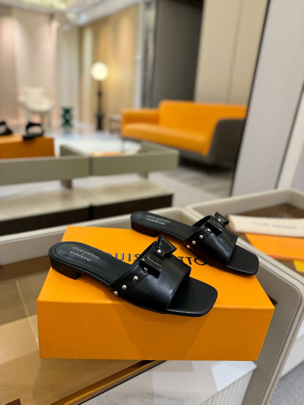 LV X TM 6AM FLAT MULE IN BLACK CALFSKIN