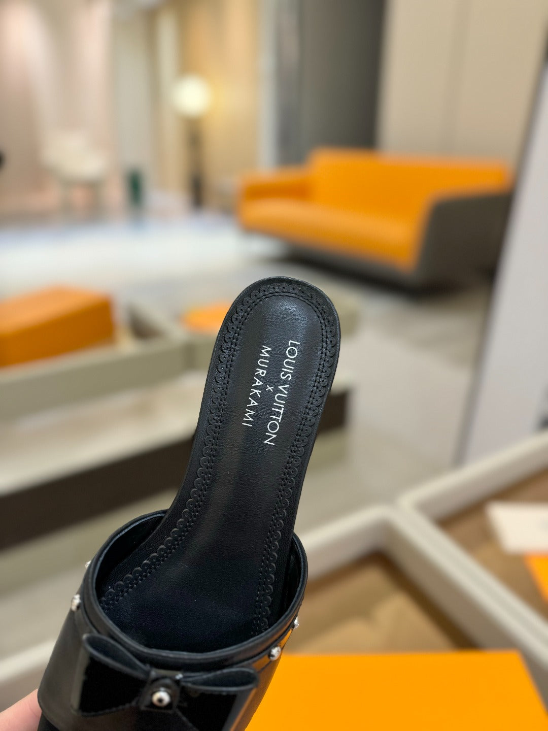 LV X TM 6AM FLAT MULE IN BLACK CALFSKIN