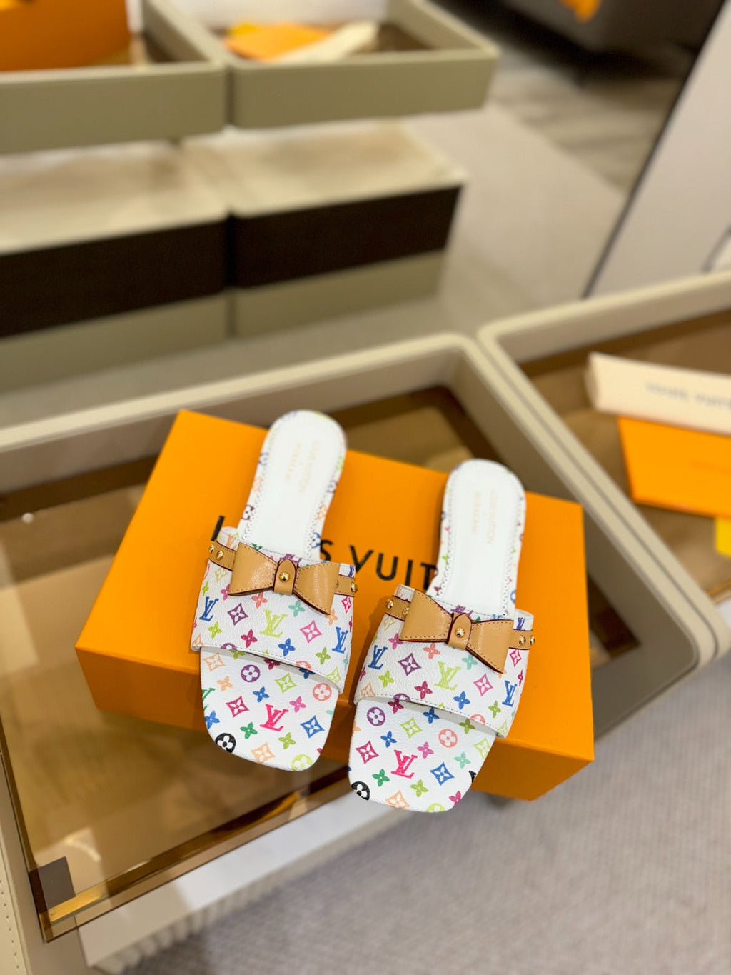 LV X TM 6AM FLAT MULE IN WHITE MONOGRAM CALFSKIN