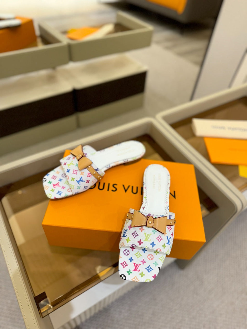 LV X TM 6AM FLAT MULE IN WHITE MONOGRAM CALFSKIN