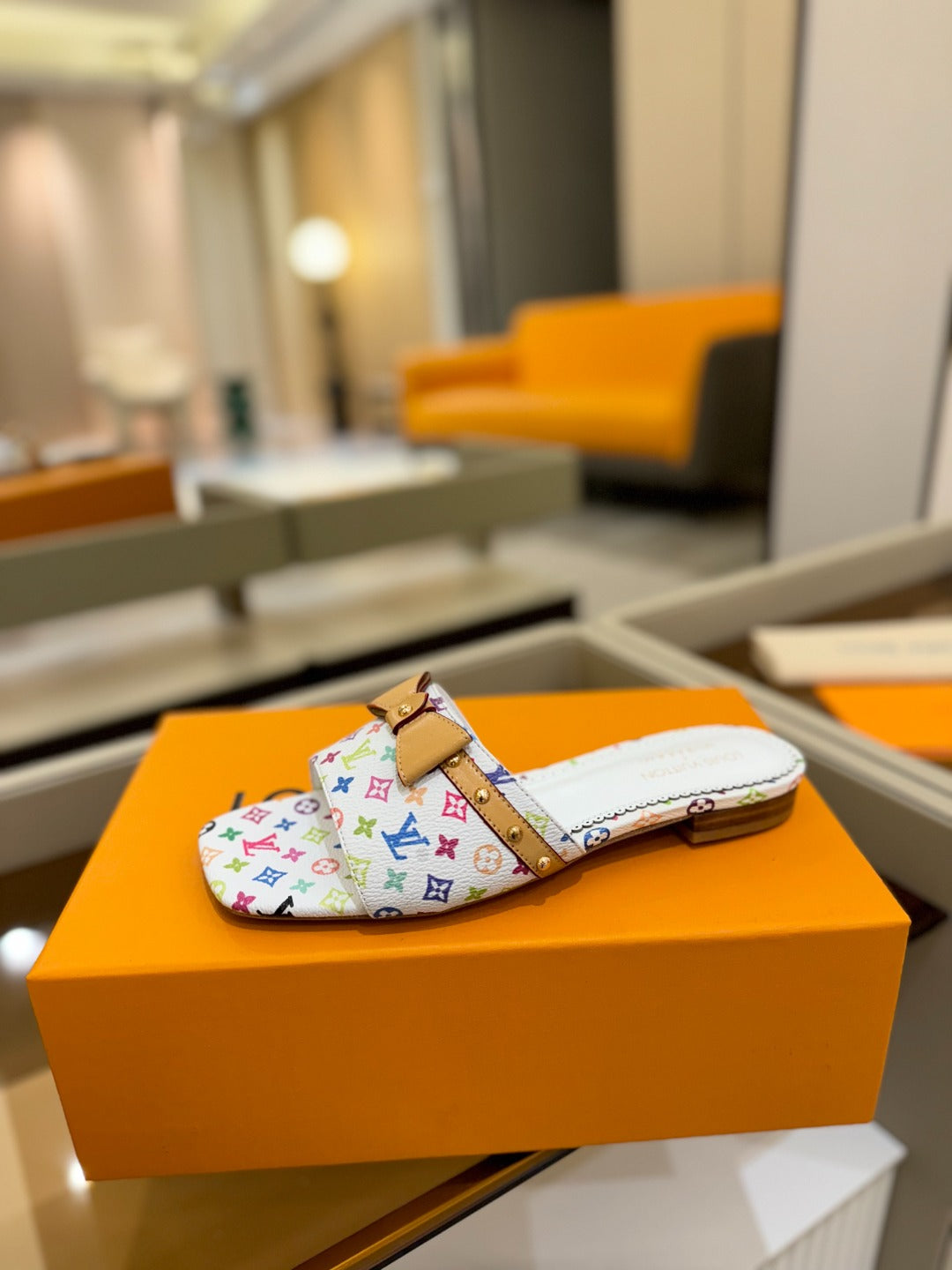 LV X TM 6AM FLAT MULE IN WHITE MONOGRAM CALFSKIN