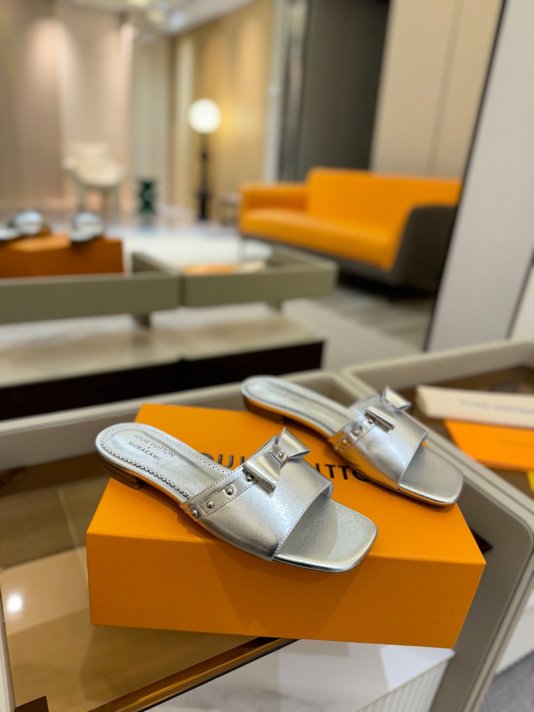 LV X TM 6AM FLAT MULE IN SILVER CALFSKIN