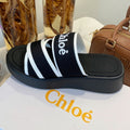 CHLOÉ WOODY WEDGE SANDALS IN BLACK MIX WHITE CANVAS WITH RUBBER SOLE