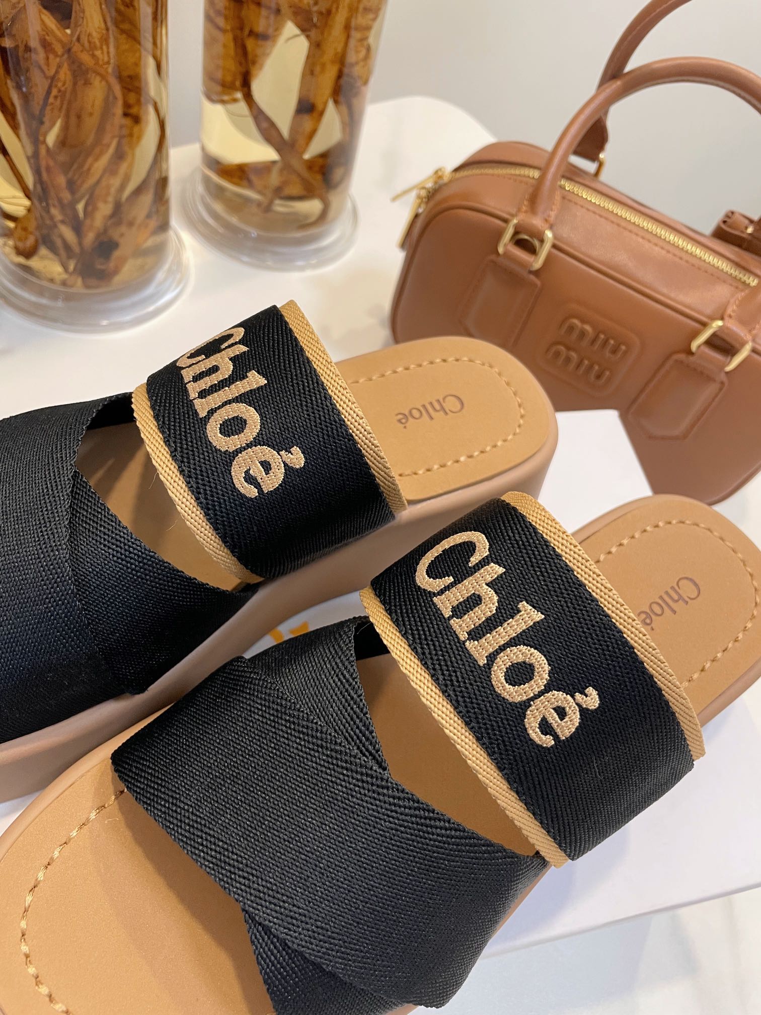 CHLOÉ WOODY WEDGE SANDALS IN BLACK CANVAS WITH CIDER BROWN RUBBER SOLE