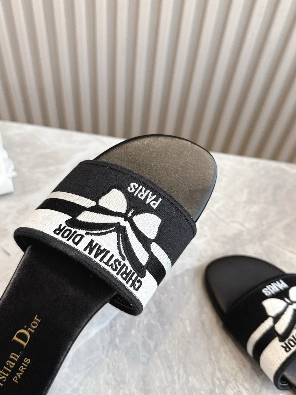 DIOR FLAT SLIDES 25S IN BLACK CALFSKIN AND FABRIC BRAND NAME EMBROIDERY