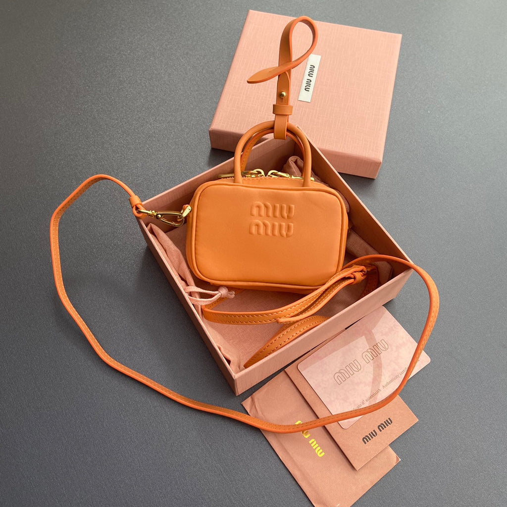 MICRO BAG KEYCHAIN 11 IN HOT CINNAMON ORANGE CALFSKIN EMBOSSED LOGO