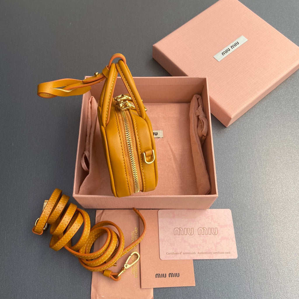 MICRO BAG KEYCHAIN 11  IN INDOCHINE ORANGE CALFSKIN EMBOSSED LOGO