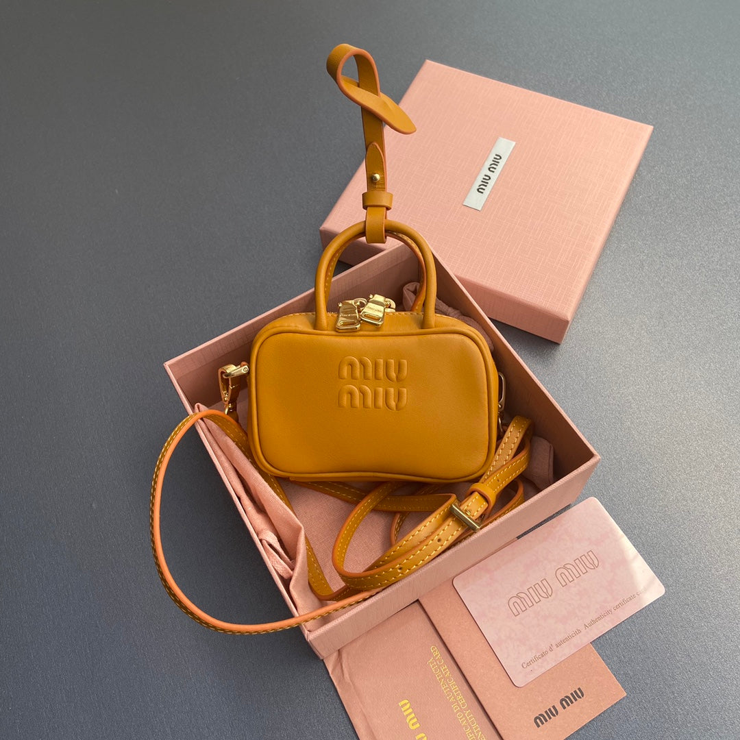 MICRO BAG KEYCHAIN 11  IN INDOCHINE ORANGE CALFSKIN EMBOSSED LOGO