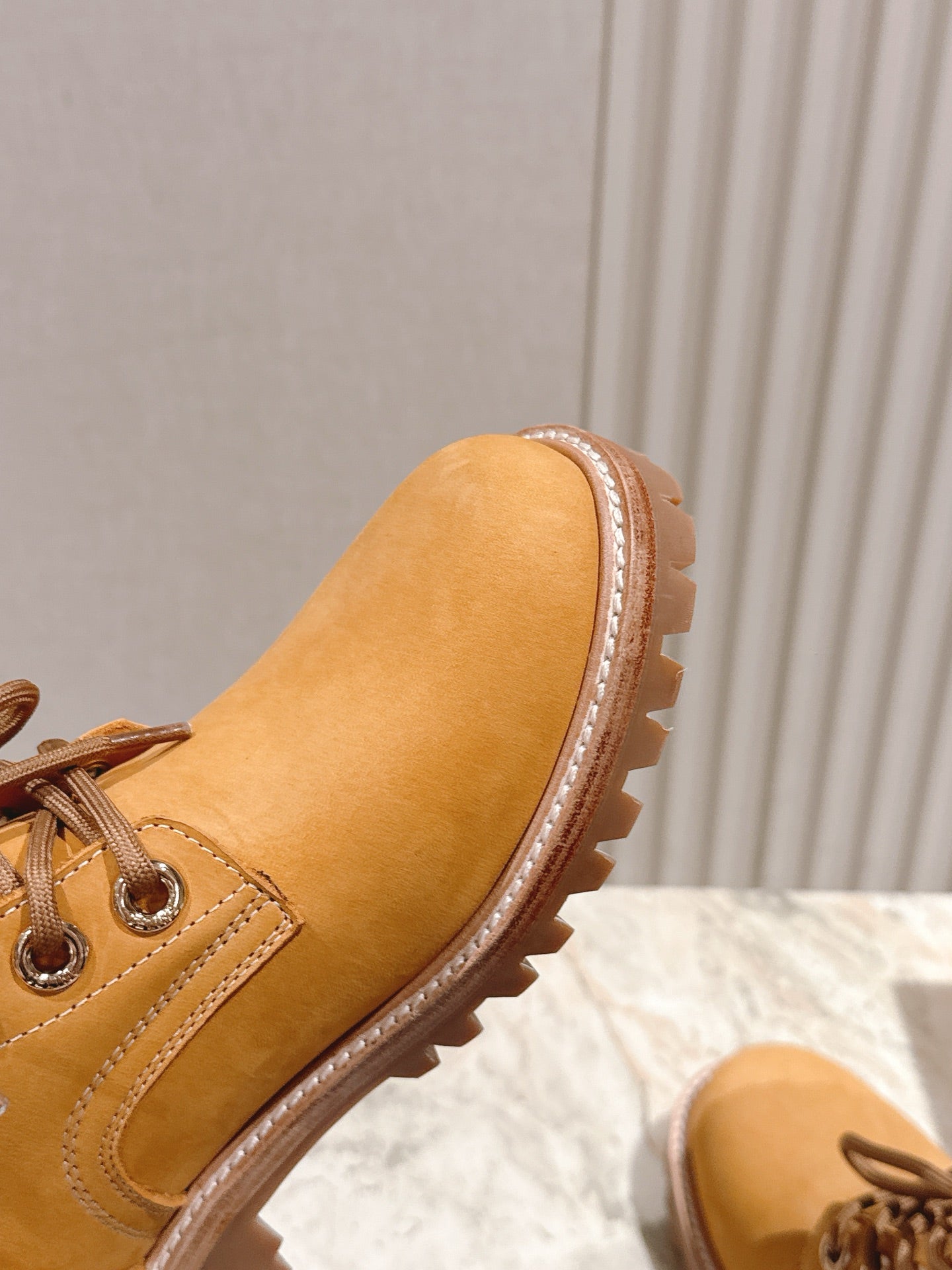 CELINE 25S MARTIN BOOTS IN MEDIUM ORANGE CALFSKIN