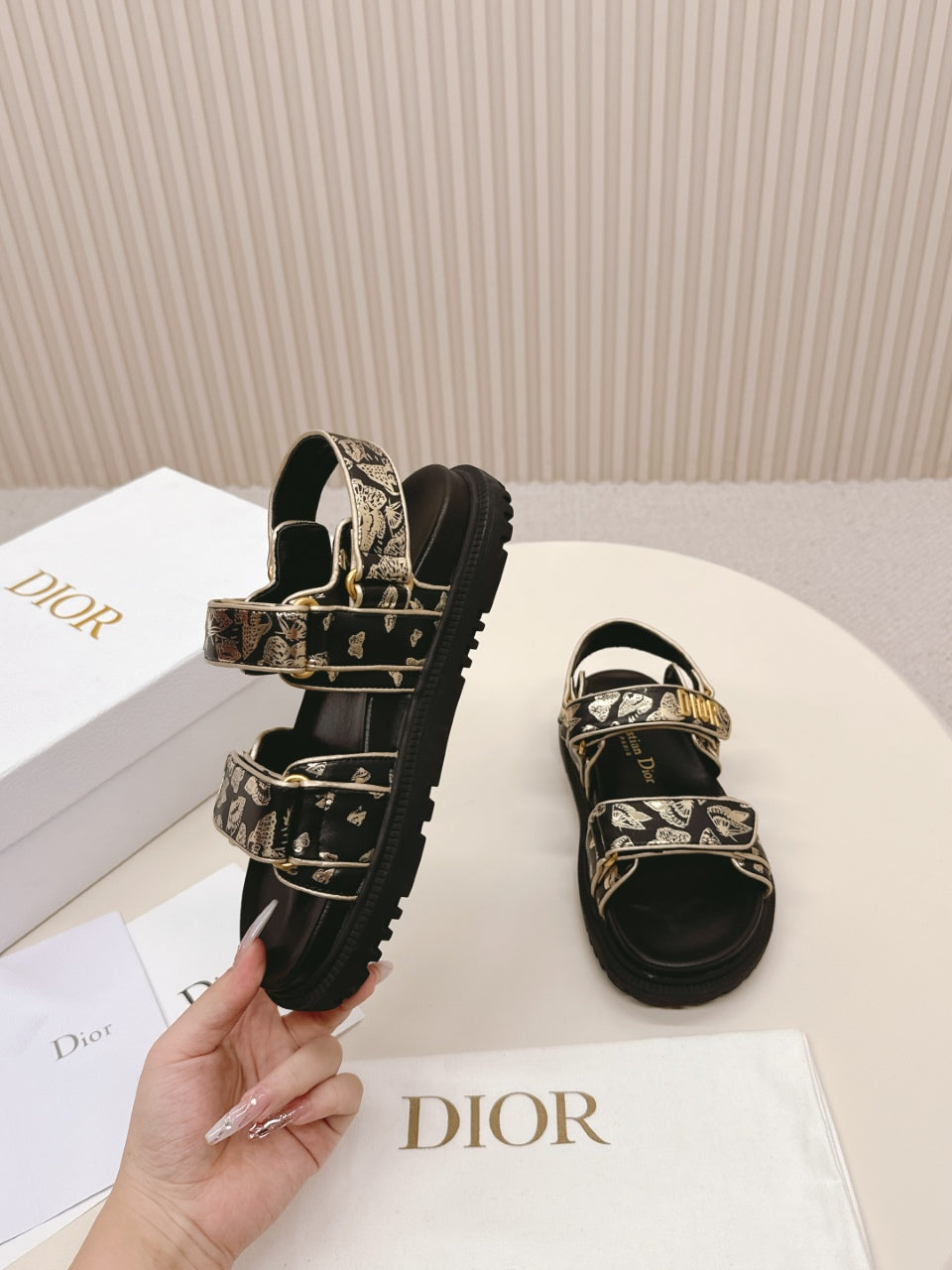 DIOR BACK-STRAP SANDALS 25S IN BLACK AND GOLD CALFSKIN WITH BUTTERFLY MOTIF