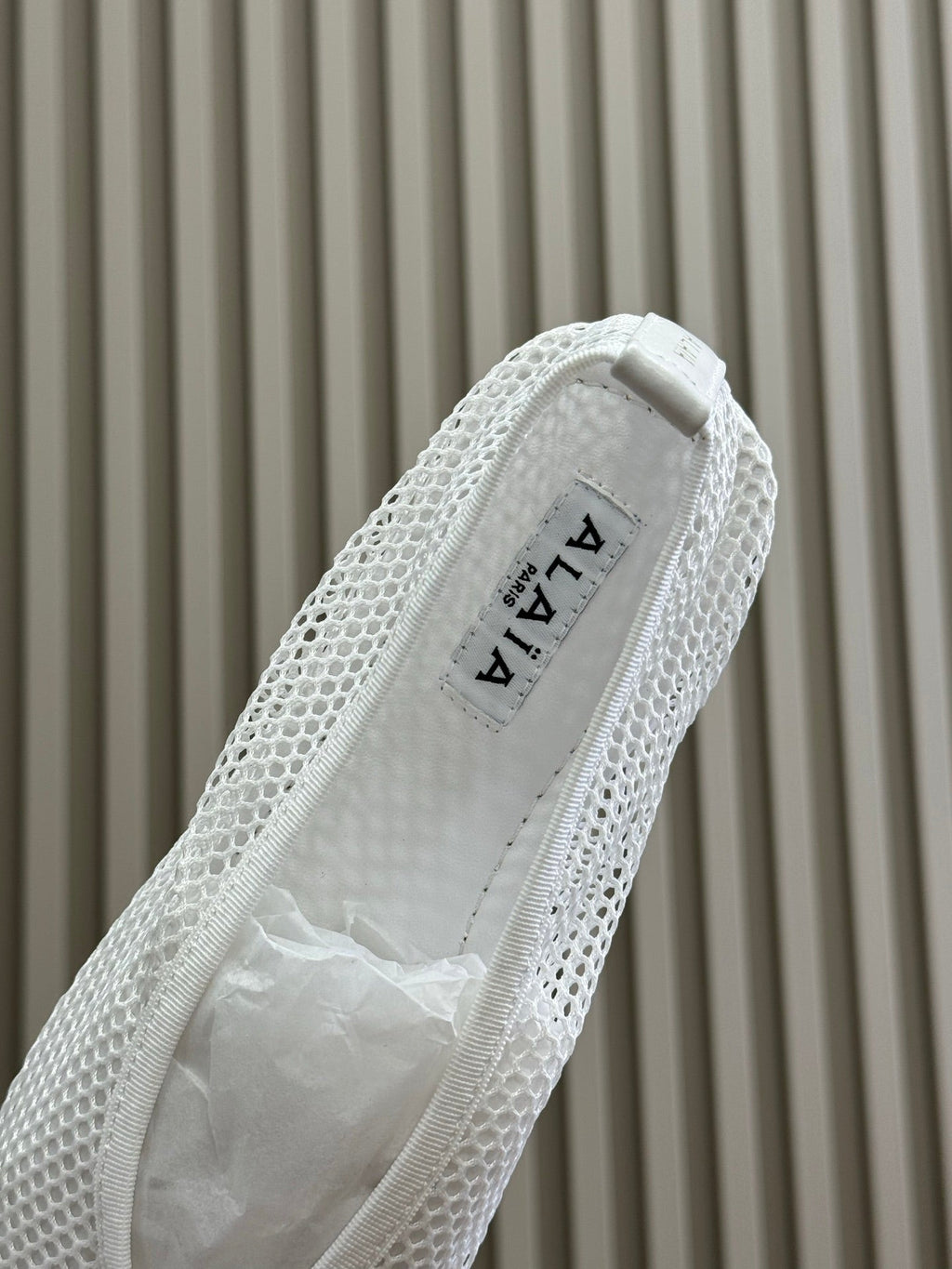 ALAIA FISHNET MESH BALLET FLATS 25S IN WHITE FABRIC