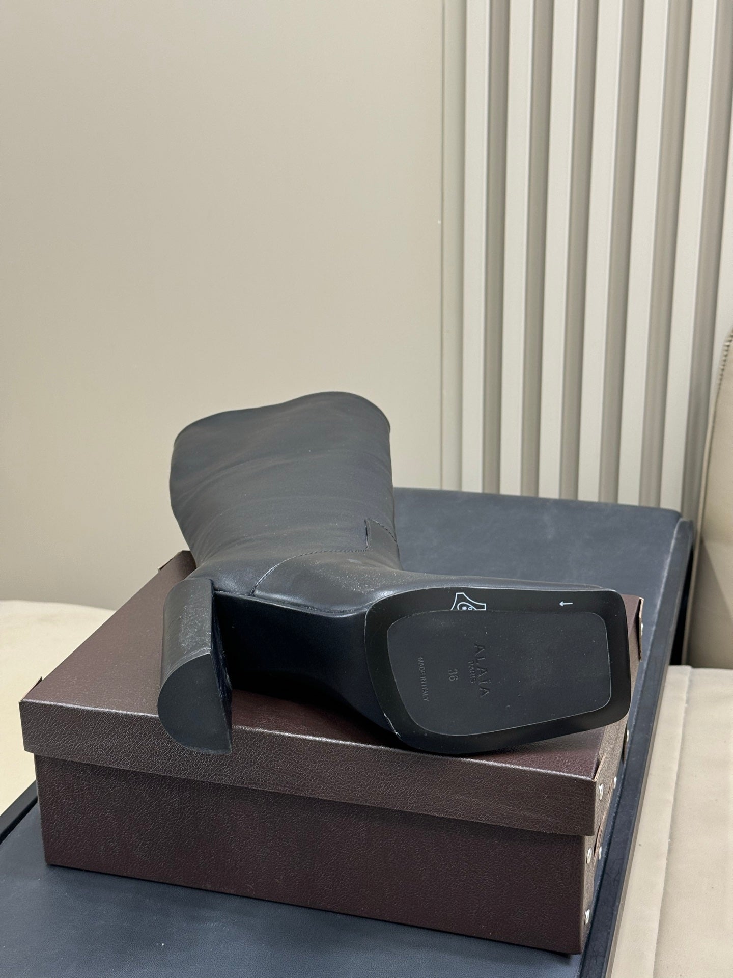 ALAIA 25S KNEE-HIGH SQUARE-TOE BOOTS IN BLACK CALFSKIN