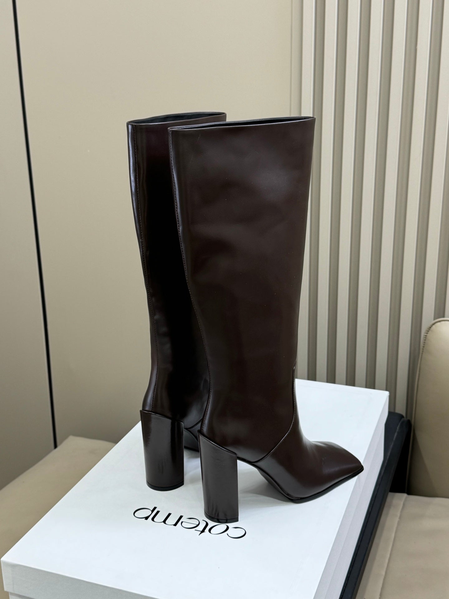 ALAIA 25S KNEE-HIGH SQUARE-TOE BOOTS IN BROWN CALFSKIN