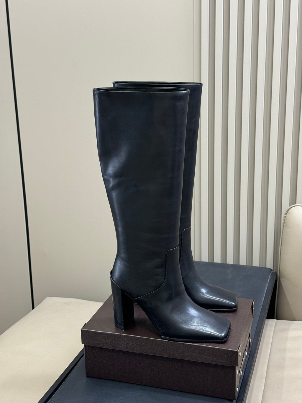 ALAIA 25S KNEE-HIGH SQUARE-TOE BOOTS IN BLACK CALFSKIN