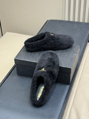 PRADA 25S CLOGS IN BLACK SHEARLING