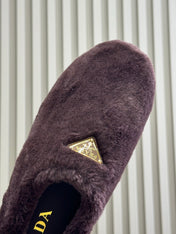 PRADA 25S CLOGS IN WINE RED SHEARLING