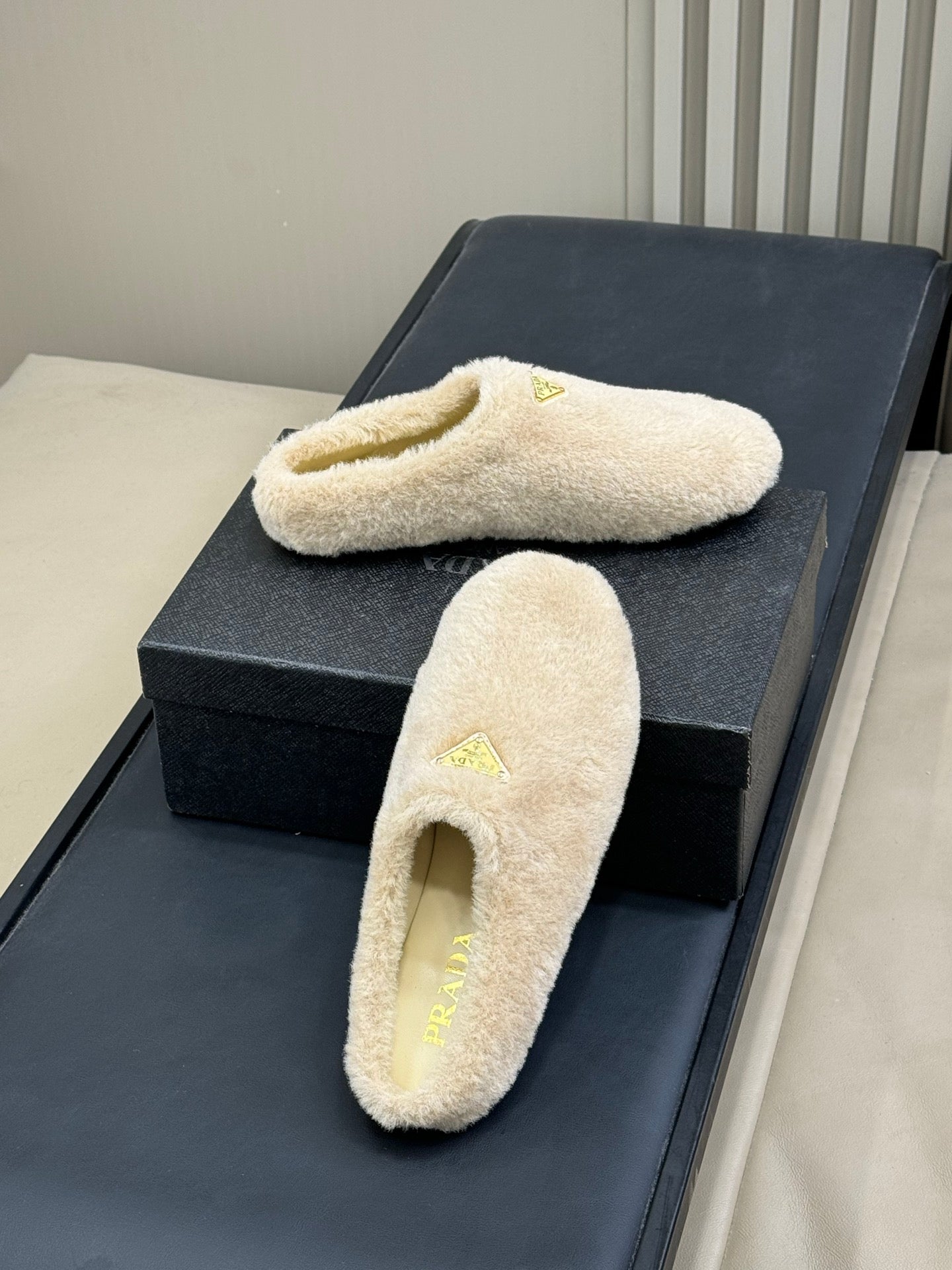 PRADA 25S CLOGS IN BEIGE SHEARLING