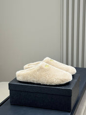 PRADA 25S CLOGS IN BEIGE SHEARLING