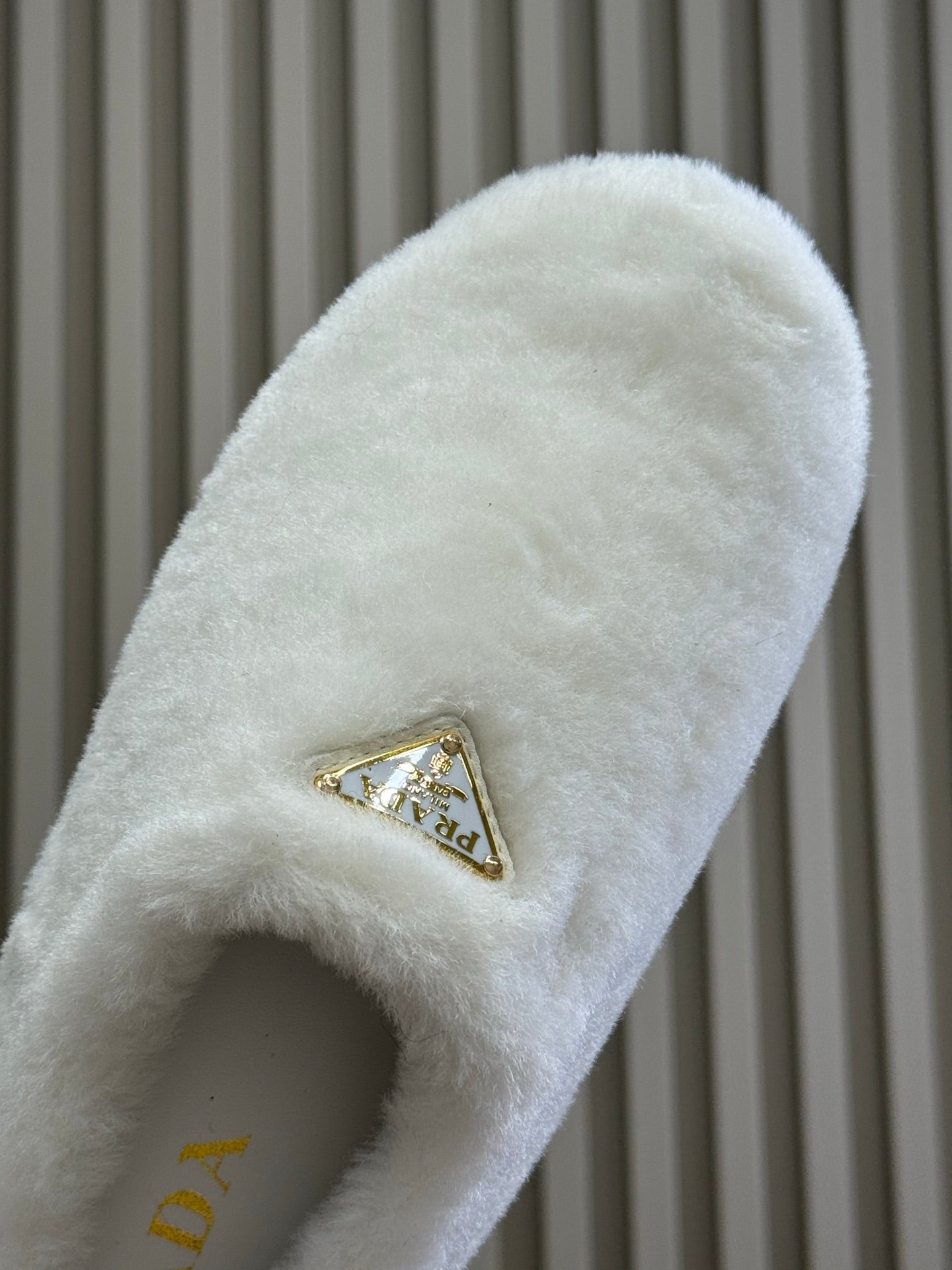 PRADA 25S CLOGS IN WHITE SHEARLING