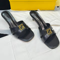 FENDI MEDIUM-HEELED 55 MM MULE IN BLACK LAMBSKIN WITH GOLD HARDWARE