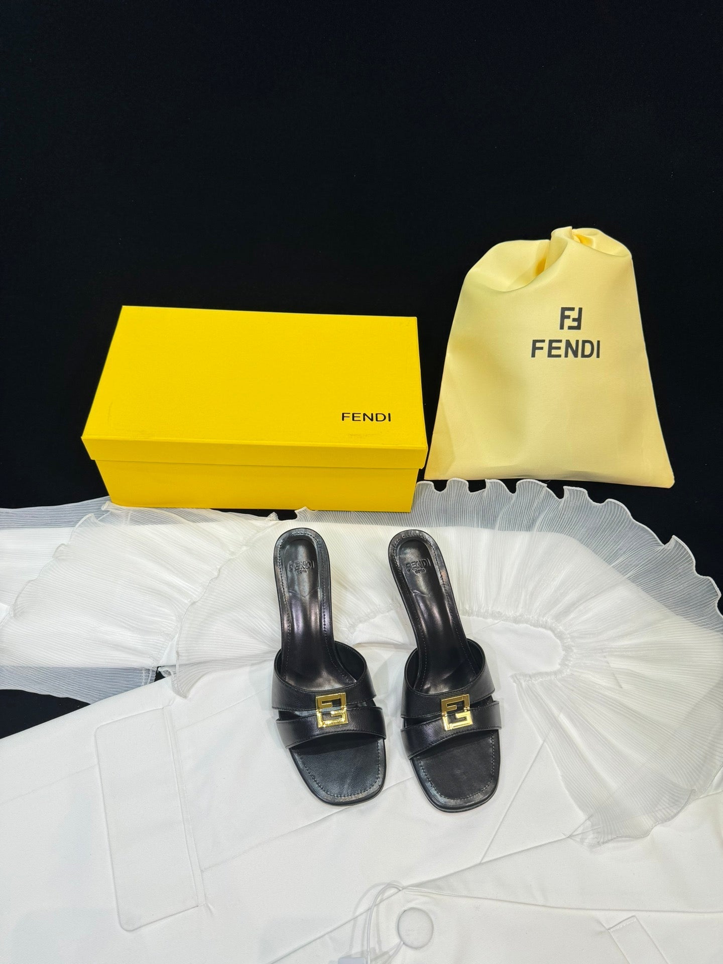 FENDI MEDIUM-HEELED 55 MM MULE IN BLACK LAMBSKIN WITH GOLD HARDWARE