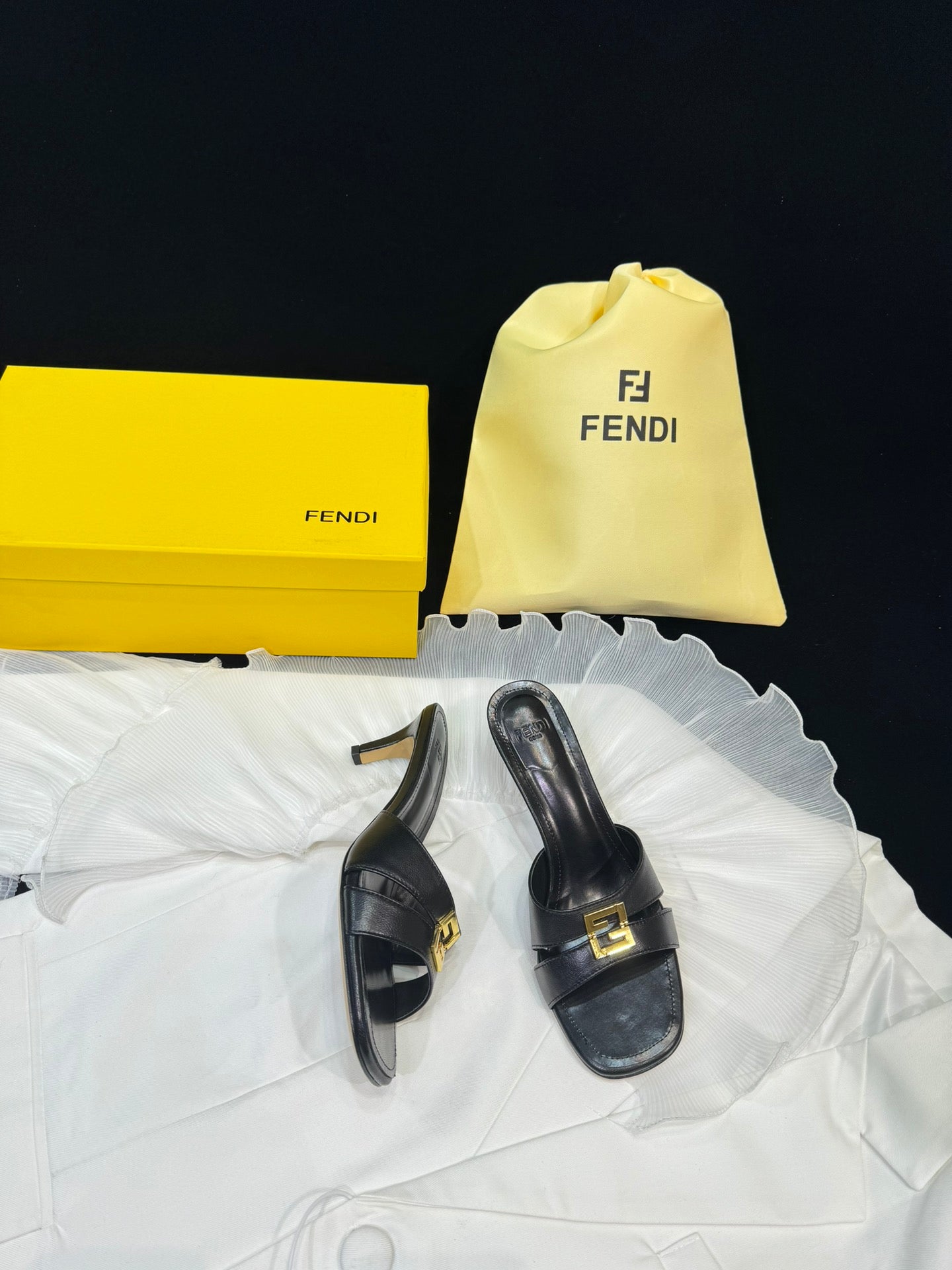 FENDI MEDIUM-HEELED 55 MM MULE IN BLACK LAMBSKIN WITH GOLD HARDWARE