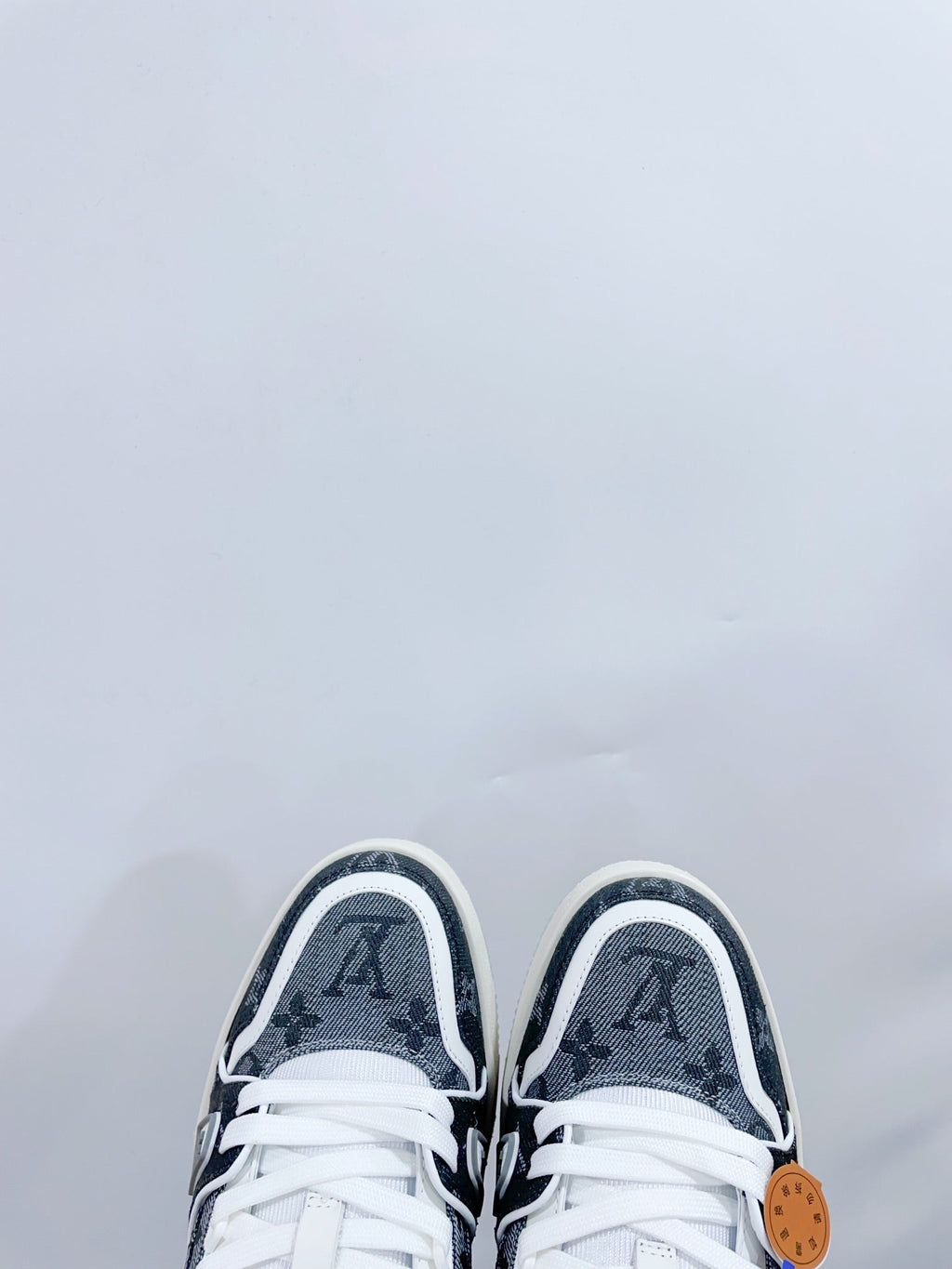 LV TRAINER SNEAKER IN DOVE GRAY MONOGRAM DENIM