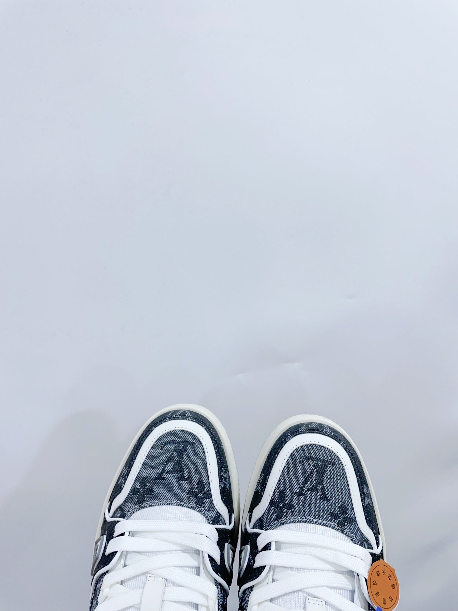 LV TRAINER SNEAKER IN DOVE GRAY MONOGRAM DENIM