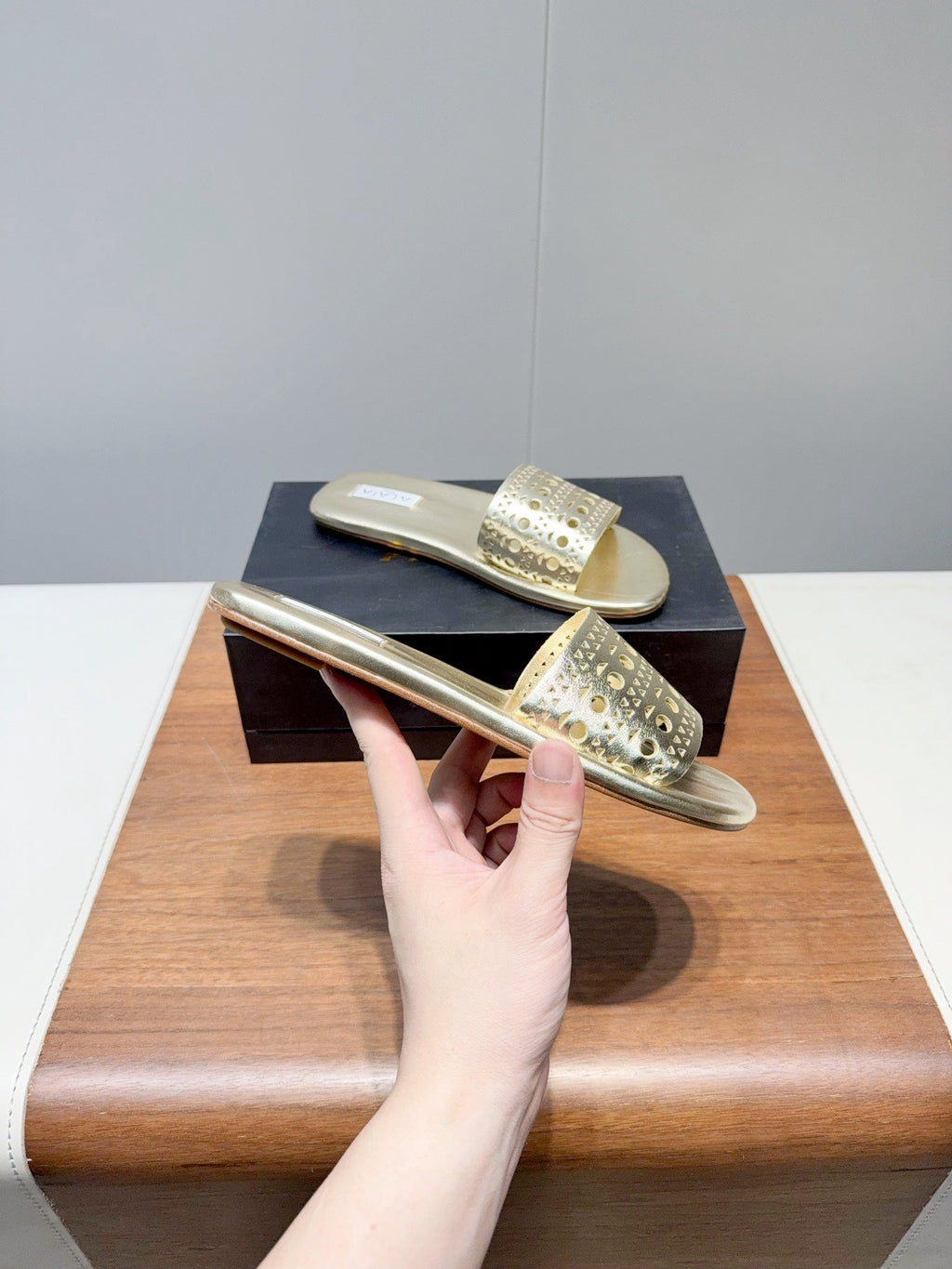 ALAIA FLAT SANDALS WITH PERFORATED STRAPS 25S IN GOLD LAMBSKIN