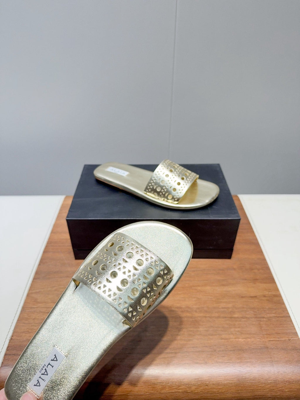 ALAIA FLAT SANDALS WITH PERFORATED STRAPS 25S IN GOLD LAMBSKIN