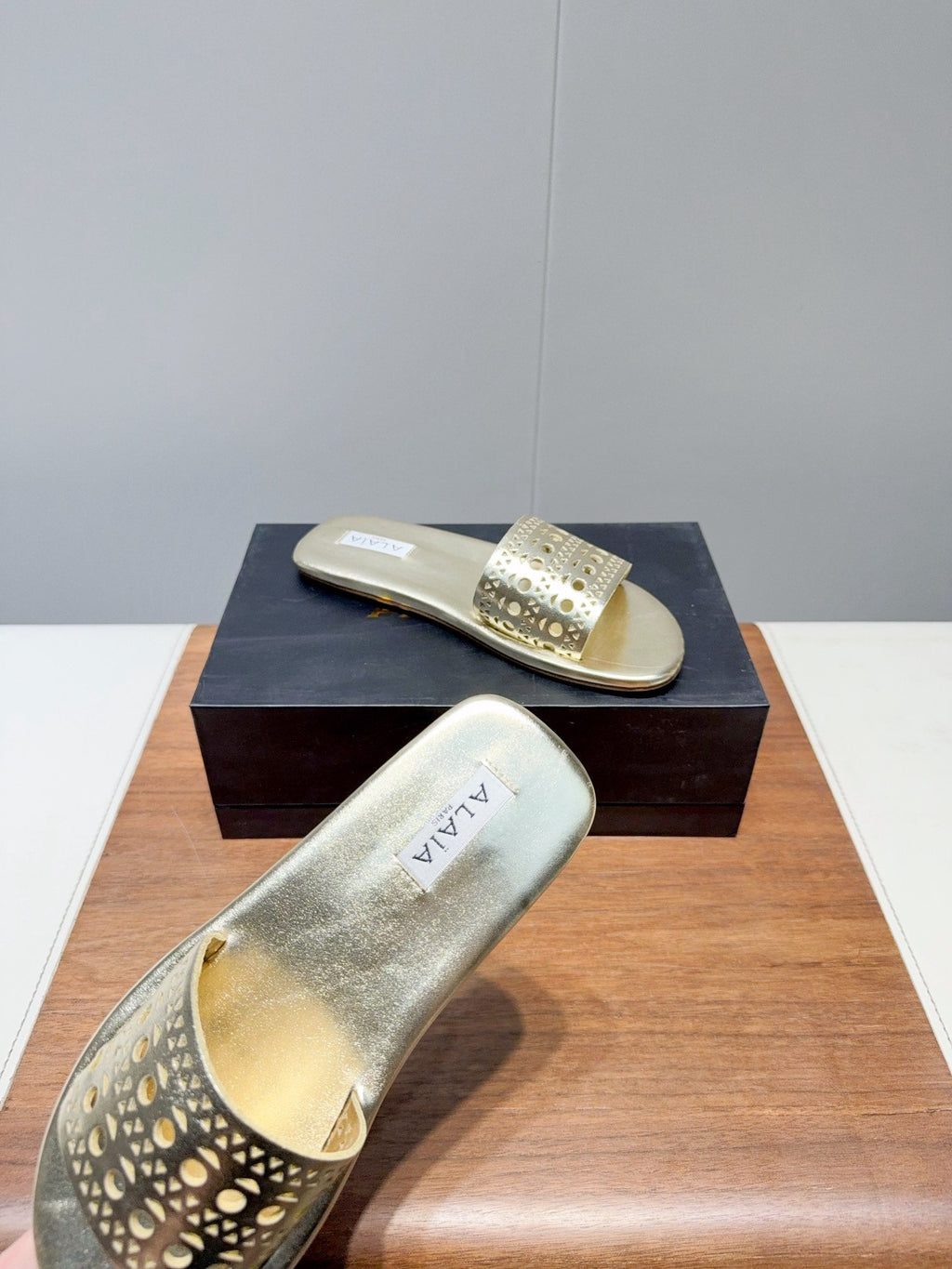 ALAIA FLAT SANDALS WITH PERFORATED STRAPS 25S IN GOLD LAMBSKIN