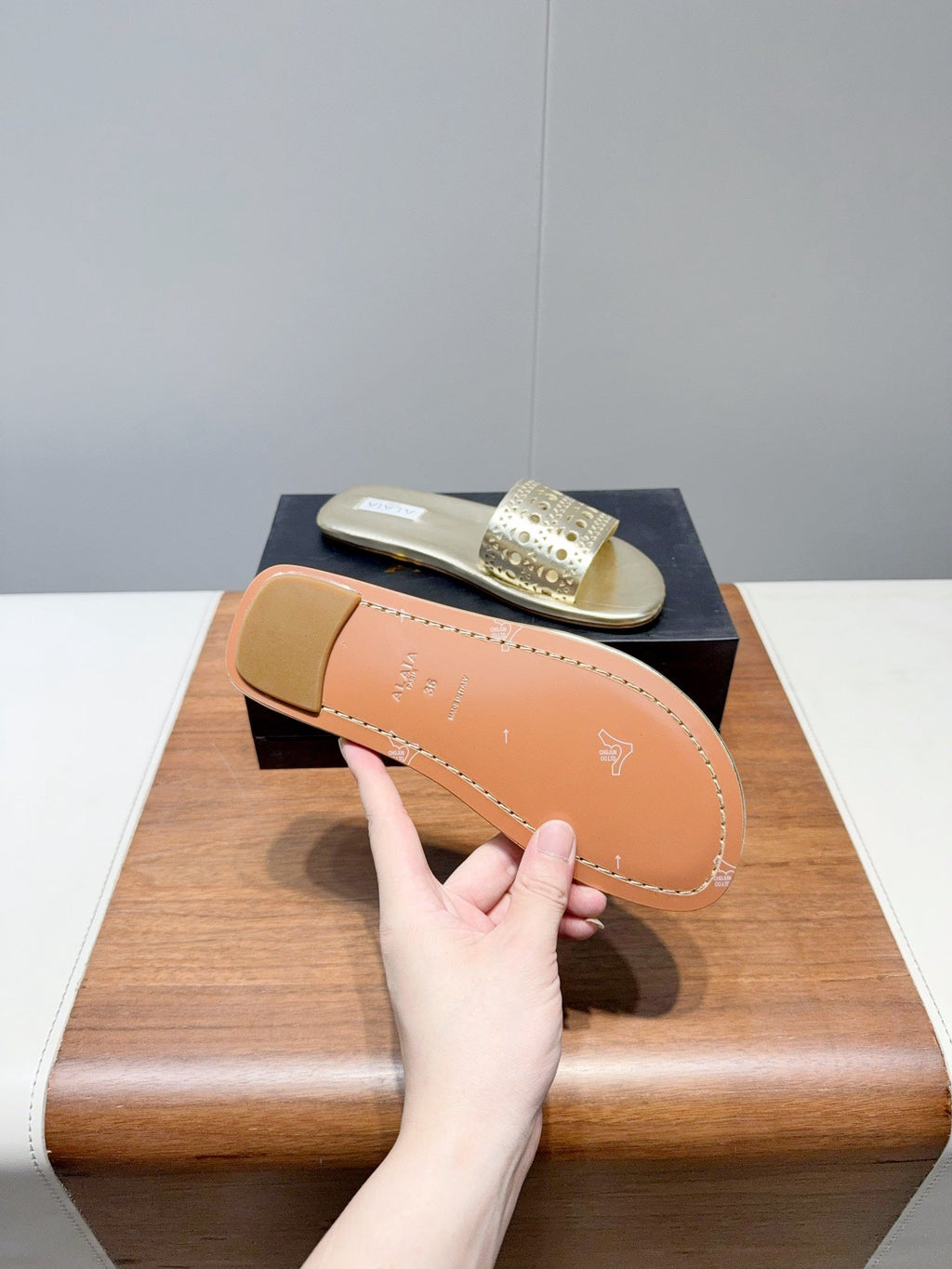 ALAIA FLAT SANDALS WITH PERFORATED STRAPS 25S IN GOLD LAMBSKIN