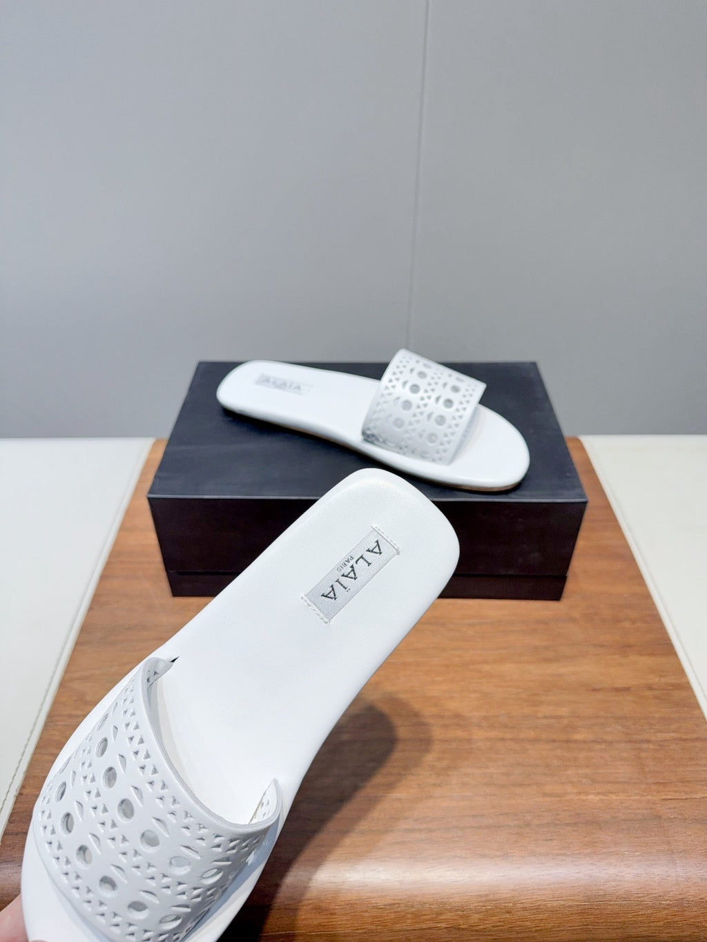 ALAIA FLAT SANDALS WITH PERFORATED STRAPS 25S IN WHITE LAMBSKIN
