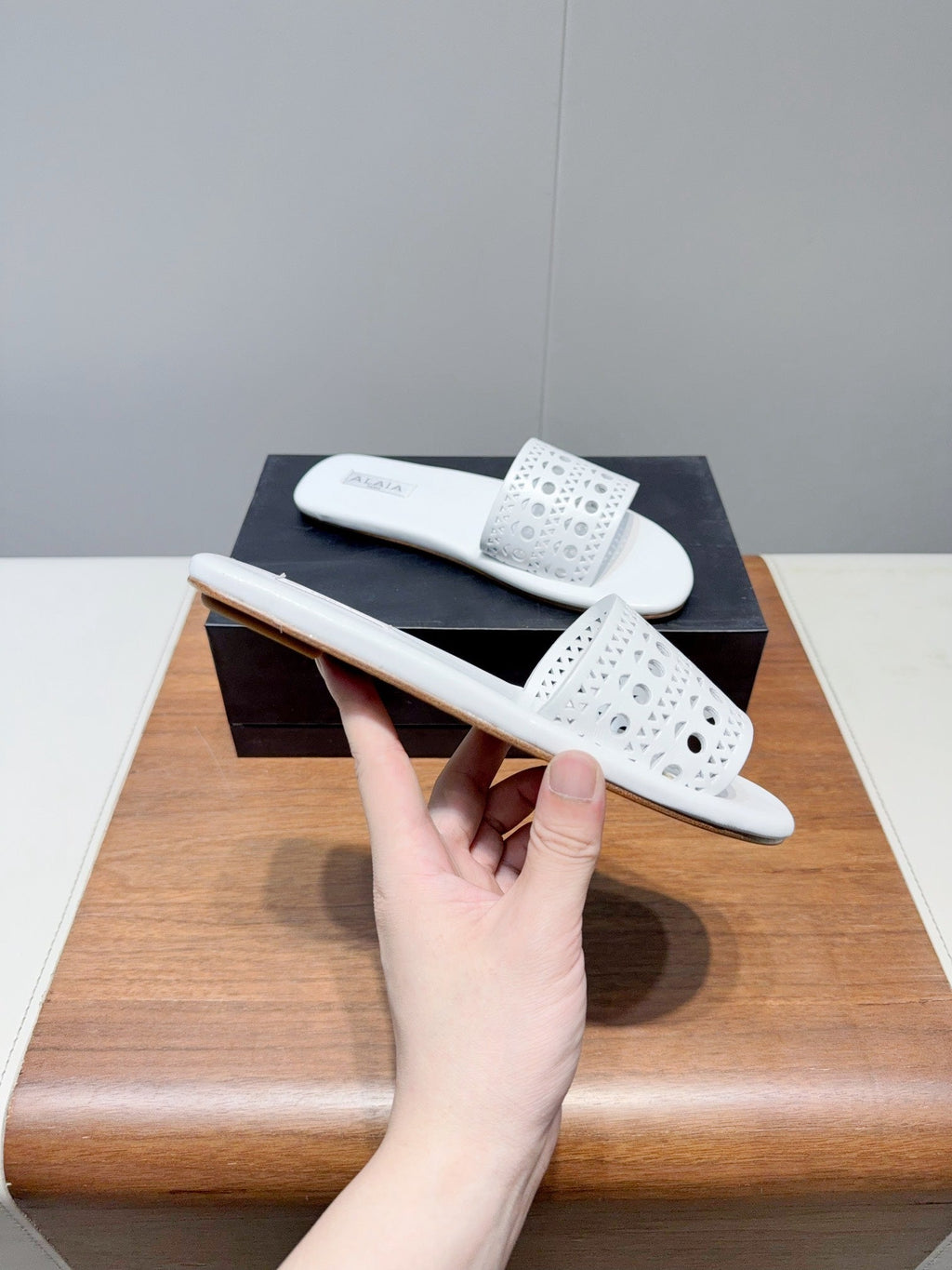 ALAIA FLAT SANDALS WITH PERFORATED STRAPS 25S IN WHITE LAMBSKIN