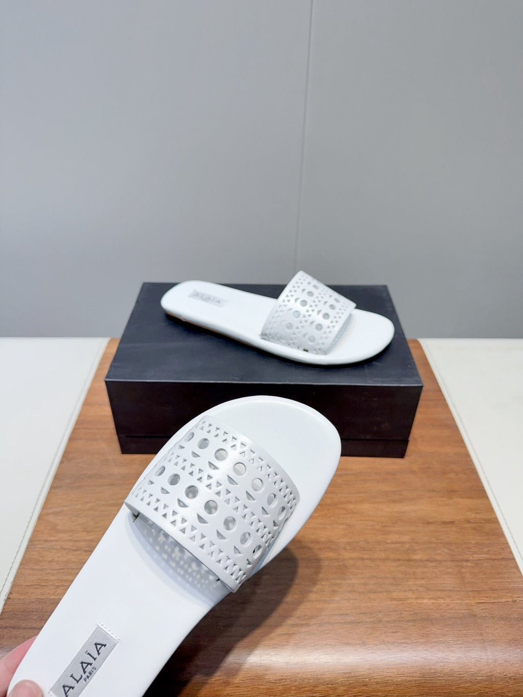 ALAIA FLAT SANDALS WITH PERFORATED STRAPS 25S IN WHITE LAMBSKIN