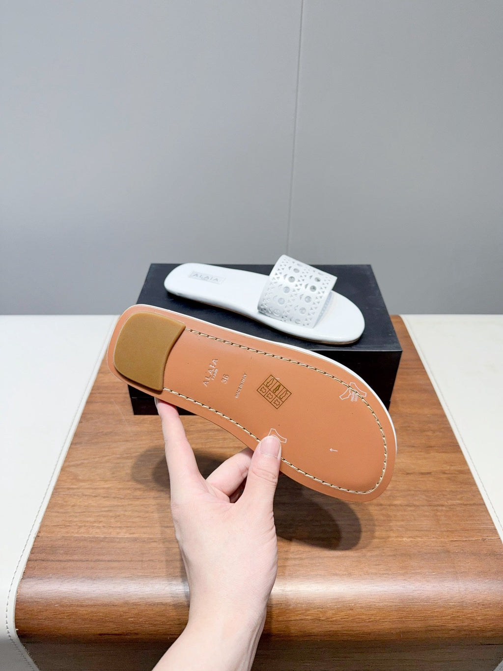 ALAIA FLAT SANDALS WITH PERFORATED STRAPS 25S IN WHITE LAMBSKIN