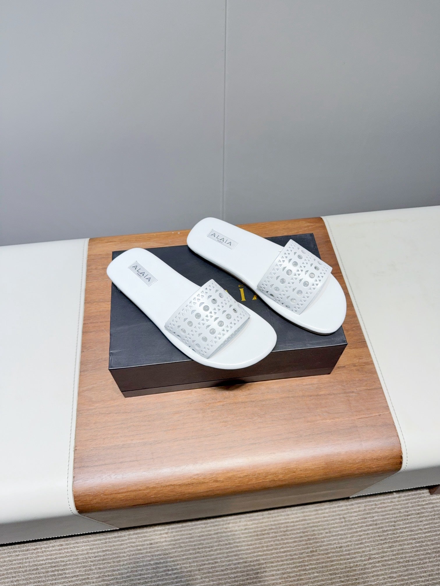 ALAIA FLAT SANDALS WITH PERFORATED STRAPS 25S IN WHITE LAMBSKIN